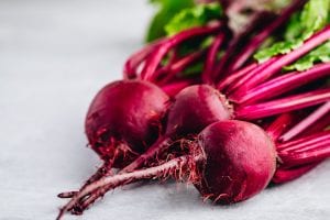 Bunch of fresh raw organic beets with leaves